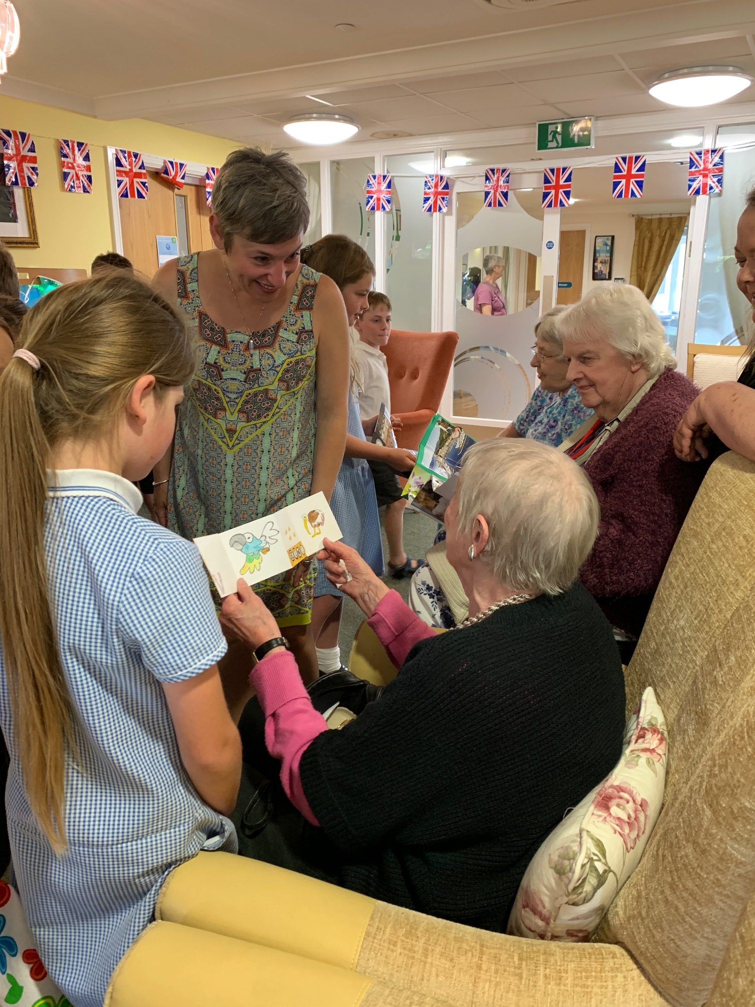 elders and school children at Wessex House care setting celebratory event where participants shared the books they produced during our project 'Suitcase Library'.